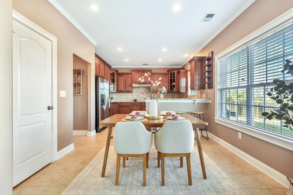 15 Fawn Hill Drive Anderson, SC 29621 - Photo 8 of 38 This spacious kitchen and dining area features warm cabinetry and ample natural light.