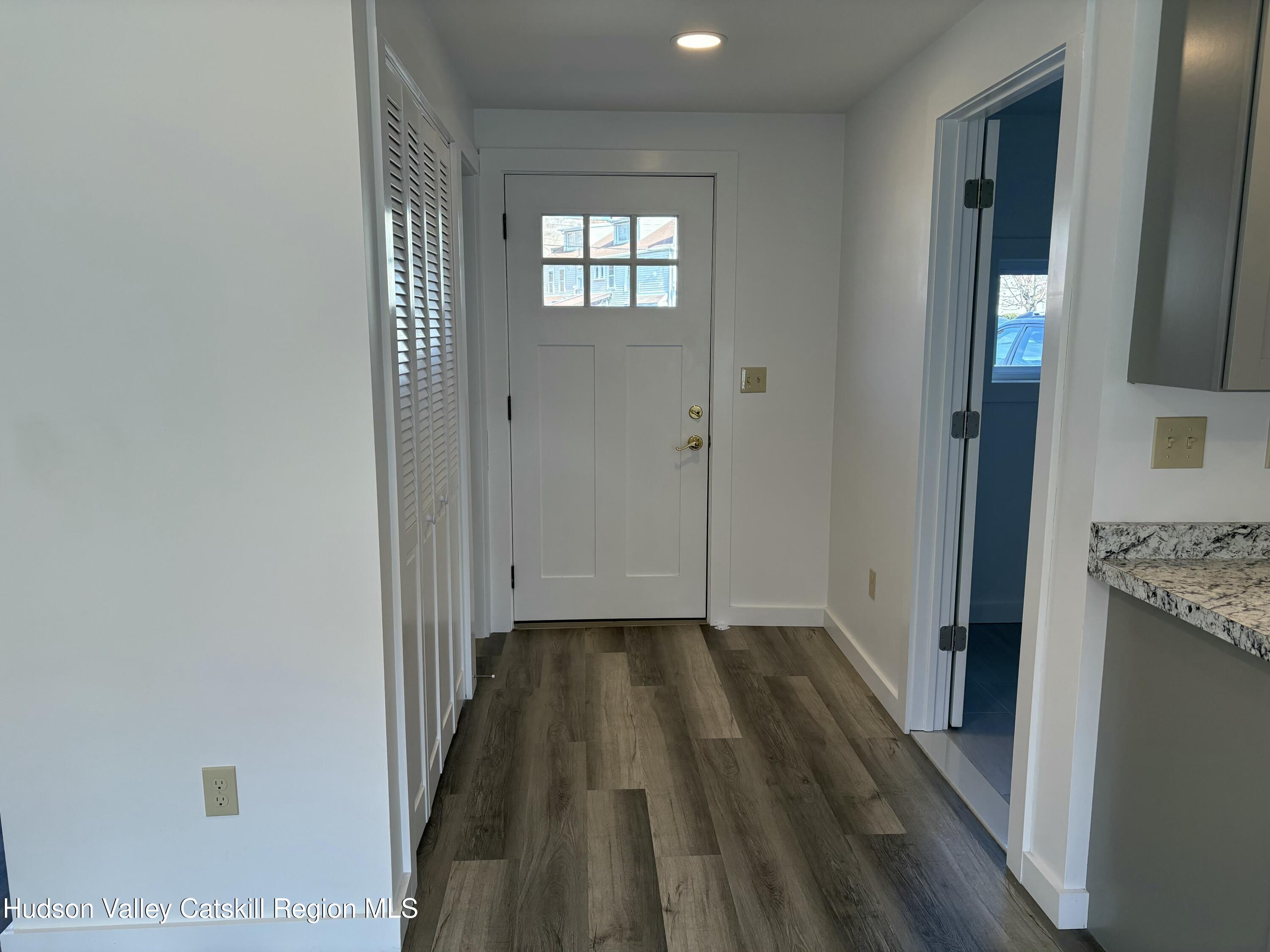 18 Market Street, Unit 1 Saugerties, NY 12477 - Photo 7 of 9 a view of hallway with wooden floor
