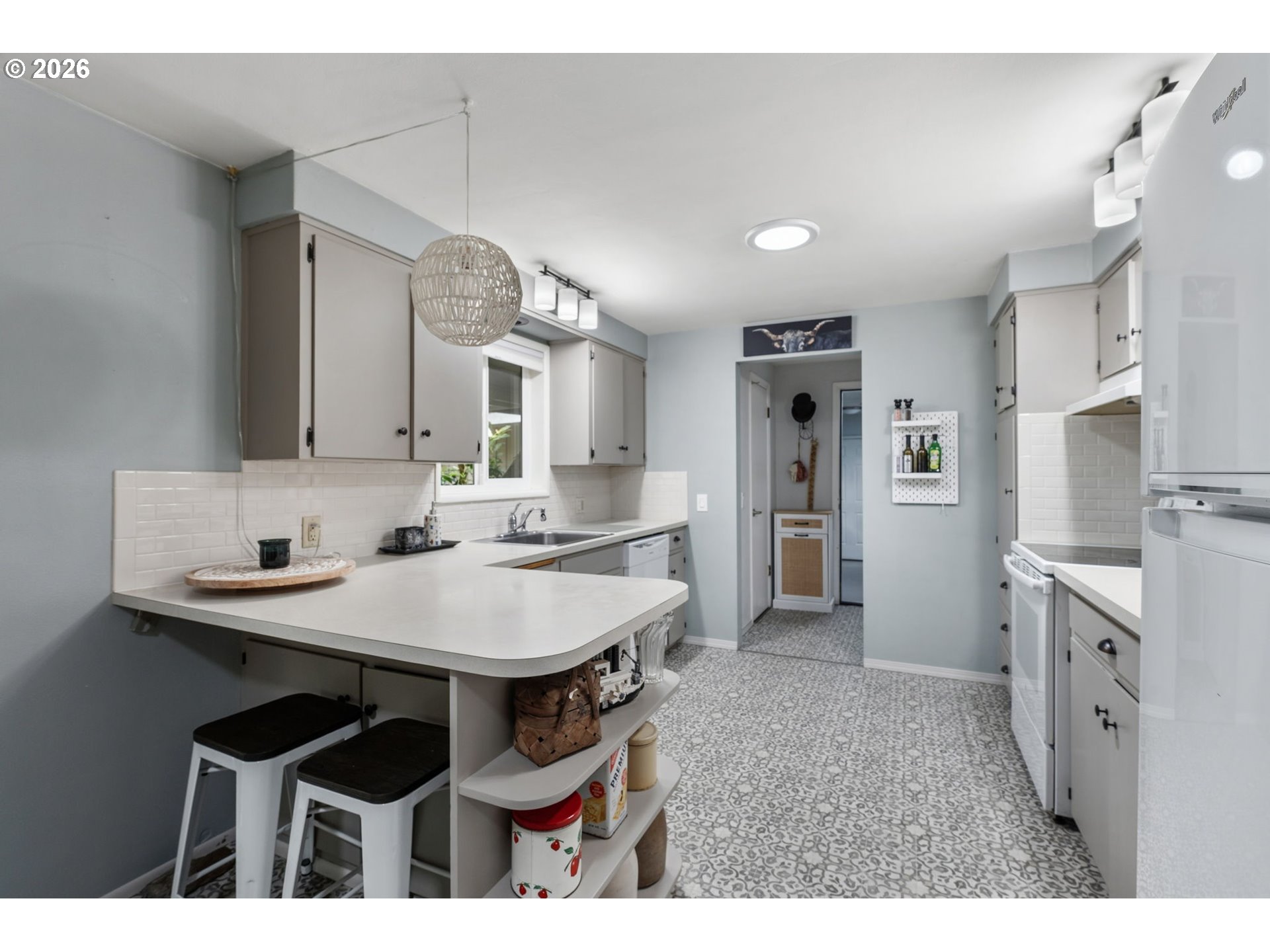 2936 Game Farm Road Springfield, OR 97477 - Photo 8 of 25 a kitchen with cabinets and refrigerator