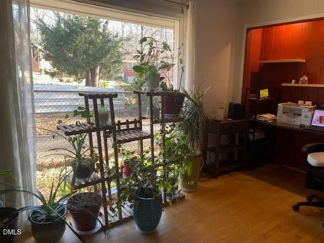 a room with a large window and chairs