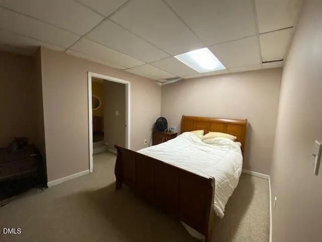 a bed room with a bed and a night stand