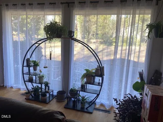 a living room with furniture and garden view