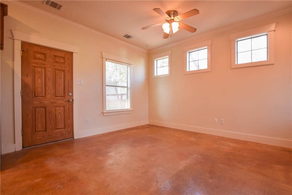5405 Avenue H, Unit B Austin, TX 78751 - Photo 5 of 13 an empty room with windows and fan