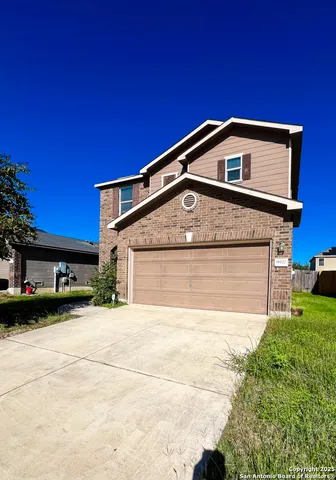 a front view of a house with yard