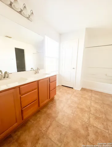 a view of kitchen with stainless steel appliances cabinets and wooden floor