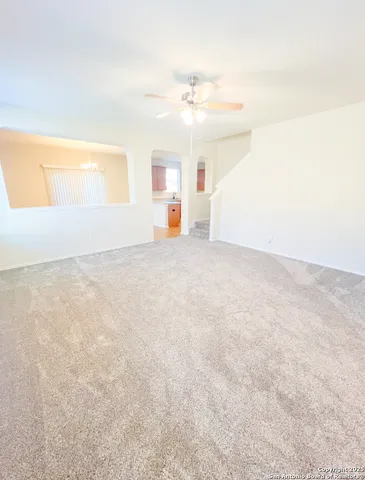 a view of a livingroom with a staircase