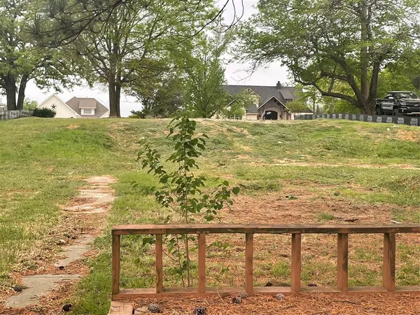 a view of a yard with an ocean view