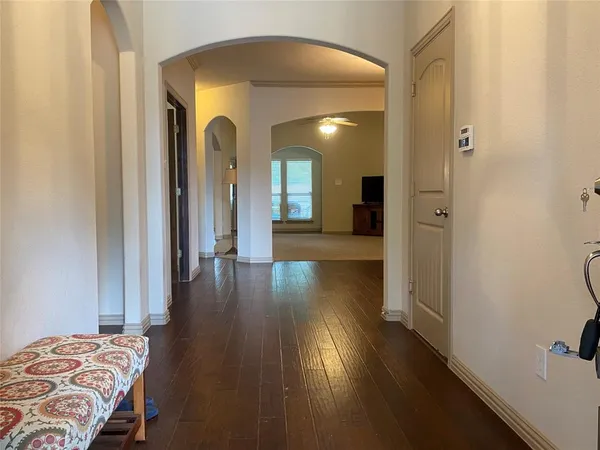 a view of a bedroom from a hallway