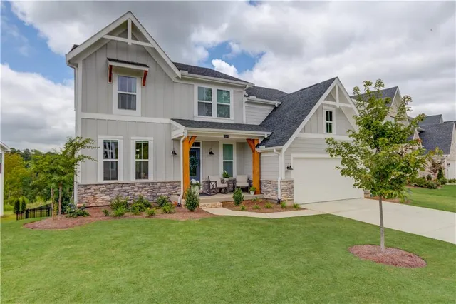 a front view of a house with garden