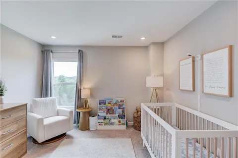 a bedroom with furniture and a window