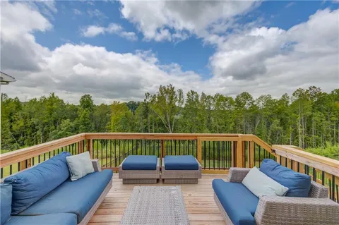 a view of roof deck with furniture