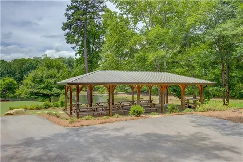 a view of a table and chairs under an umbrella