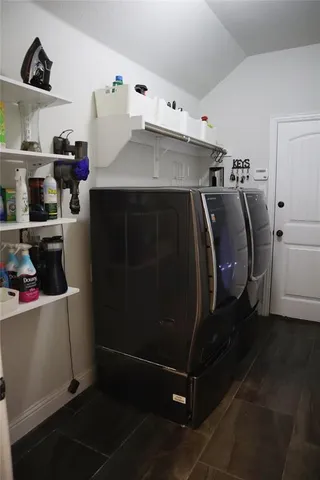 a spacious bedroom with a bed and window