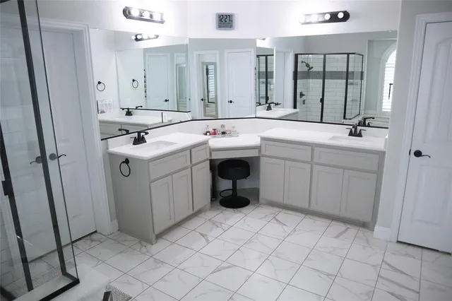 a bathroom with a bathtub and a shower