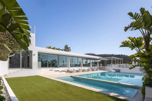 a view of swimming pool with outdoor seating and deck
