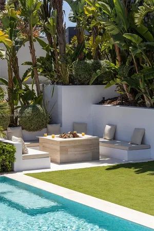 a living room with furniture and large windows