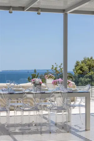 a view of a dining room with furniture window and outside view