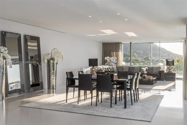 a bedroom with a large bed and a couch