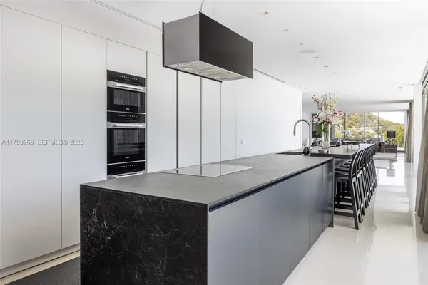 a spacious bedroom with a bed and a large window