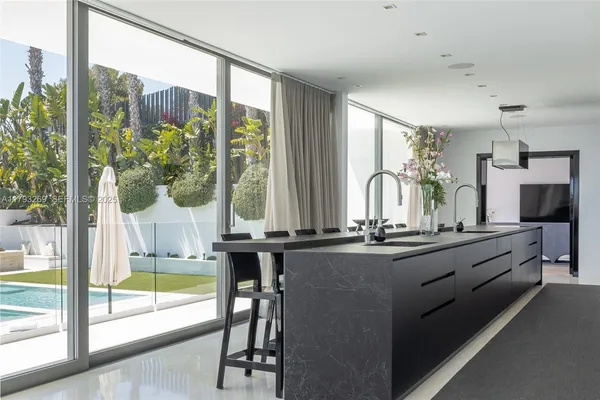 a bedroom with a large bed and a large window