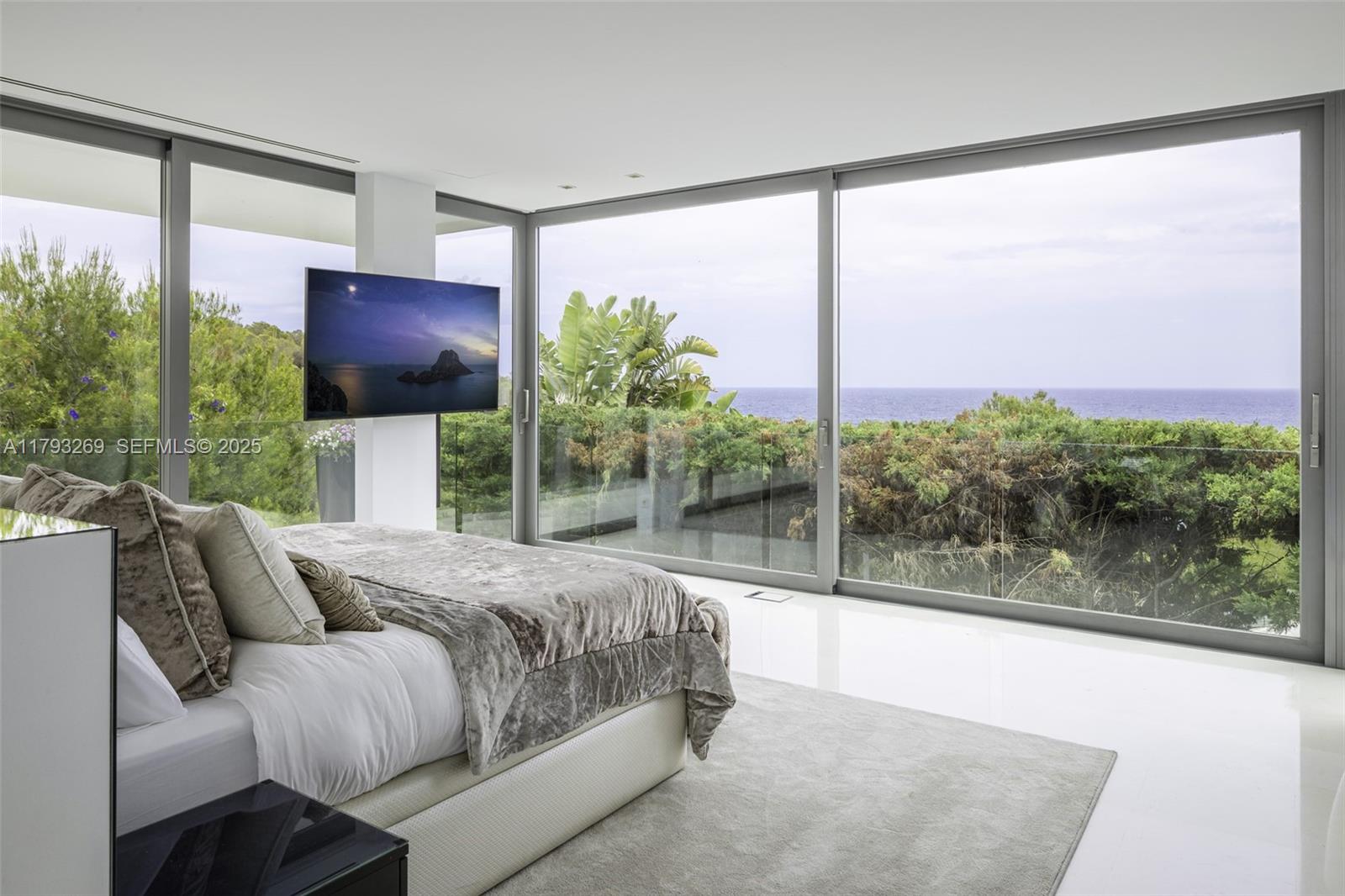 North Cathedral City undefined, FL 00000 - Photo 35 of 70 a living room with furniture a flat screen tv and a floor to ceiling window