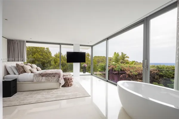 a bathroom with a sink a mirror and a bathtub