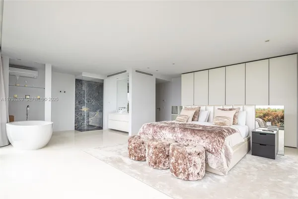 a white toilet sitting next to a bathroom sink