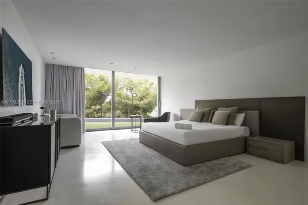 a bathroom with a granite countertop shower and a toilet