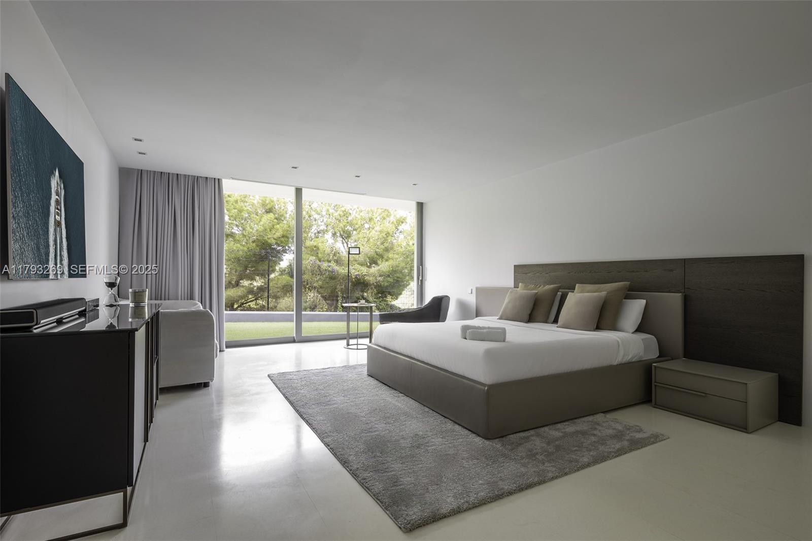 North Cathedral City undefined, FL 00000 - Photo 40 of 70 a spacious bedroom with a bed and a large window