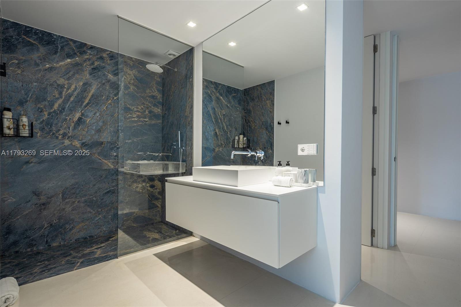 North Cathedral City undefined, FL 00000 - Photo 47 of 70 a bathroom with a granite countertop sink a mirror and a shower