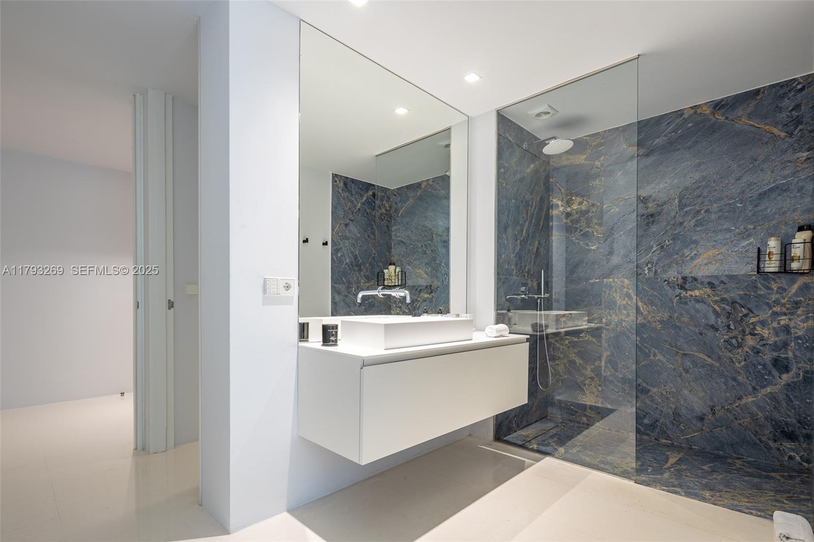 North Cathedral City undefined, FL 00000 - Photo 48 of 70 a bathroom with a sink a mirror and a bathtub