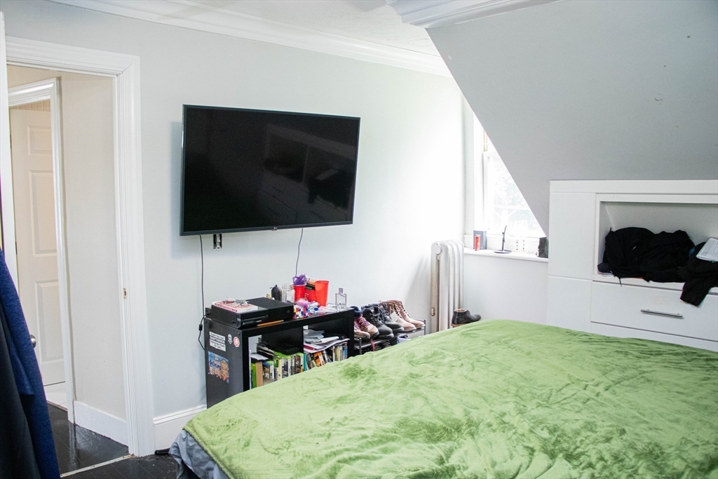 85-87 Slater Street Webster, MA 01570 - Photo 19 of 41 a living room with furniture and a flat screen tv