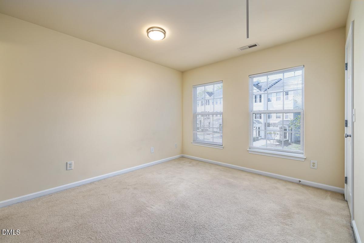 1619 Snow Mass Way Durham, NC 27713 - Photo 13 of 16 an empty room with windows