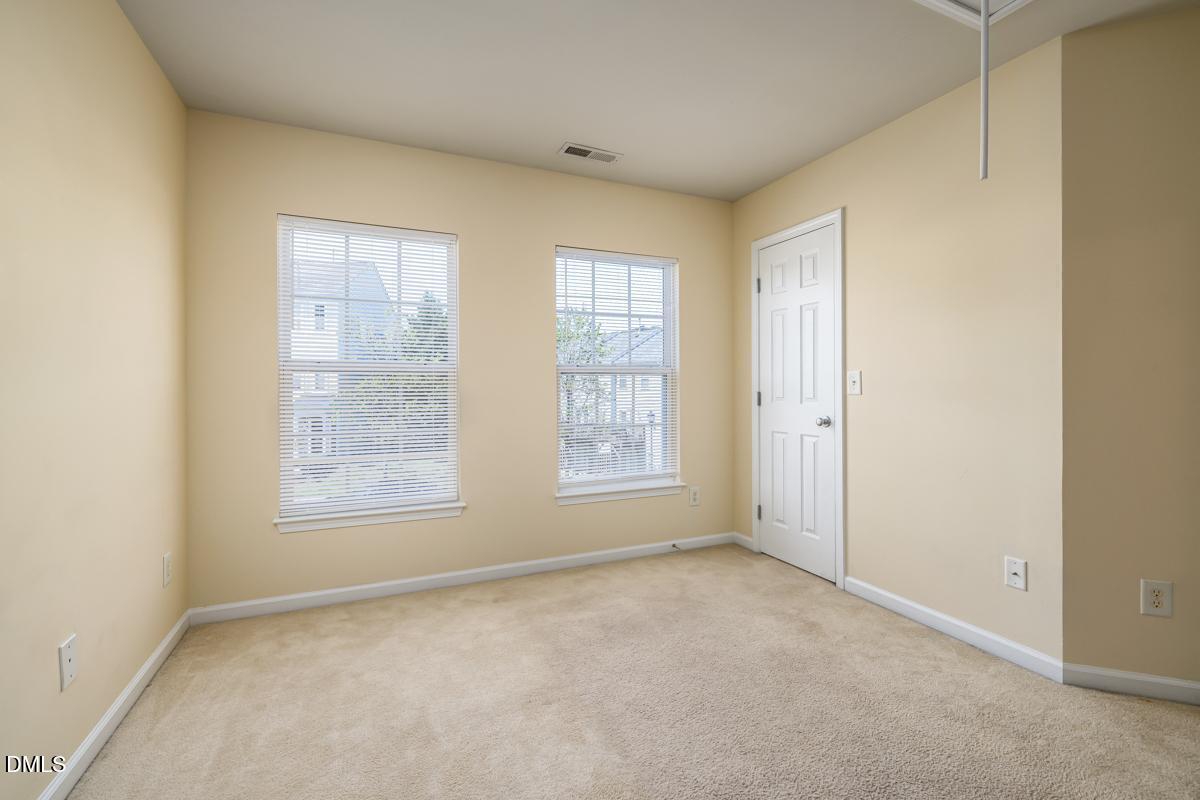 1619 Snow Mass Way Durham, NC 27713 - Photo 14 of 16 an empty room with windows
