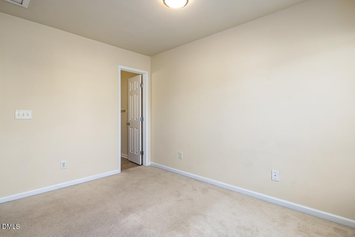 1619 Snow Mass Way Durham, NC 27713 - Photo 16 of 16 an empty room with a workbench
