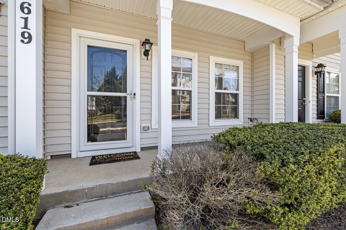 1619 Snow Mass Way Durham, NC 27713 - Photo 3 of 16 a front view of a house with a yard