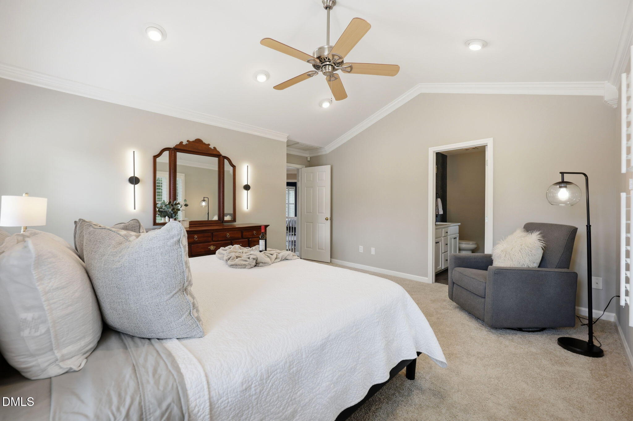 1716 Farmington Grove Drive Raleigh, NC 27614 - Photo 21 of 41 a bedroom with bed and a chandelier
