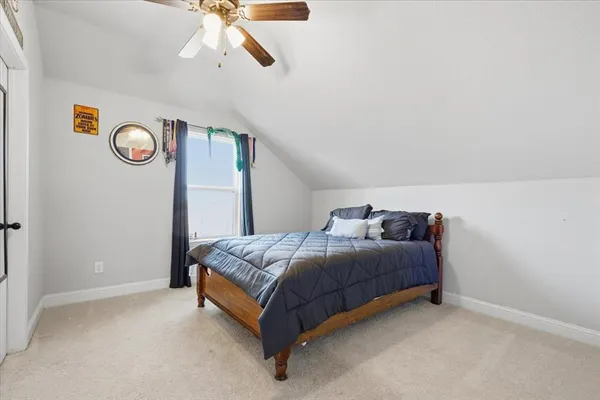 a bedroom with a bed and a table