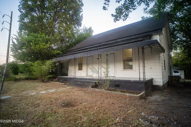 a front view of a house with yard