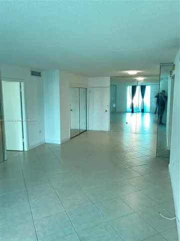 a view of a hallway with an empty room