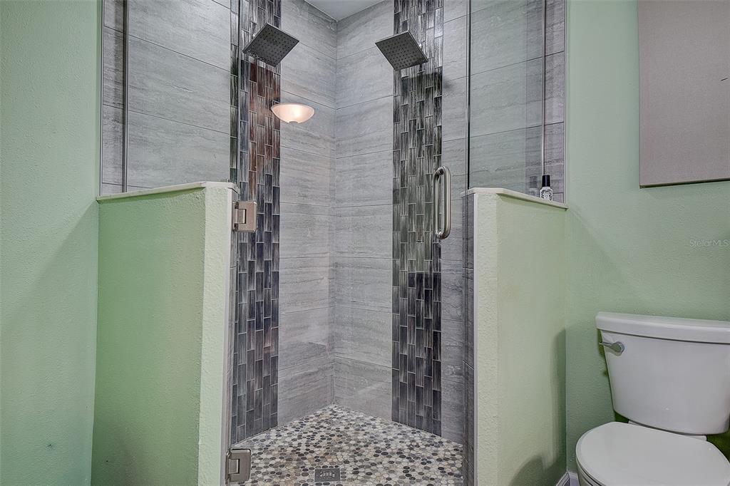 14859 Seminole Trail Seminole, FL 33776 - Photo 24 of 56 a bathroom with a toilet and shower