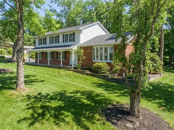 a aerial view of a house with a yard