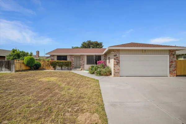 a front view of a house with yard