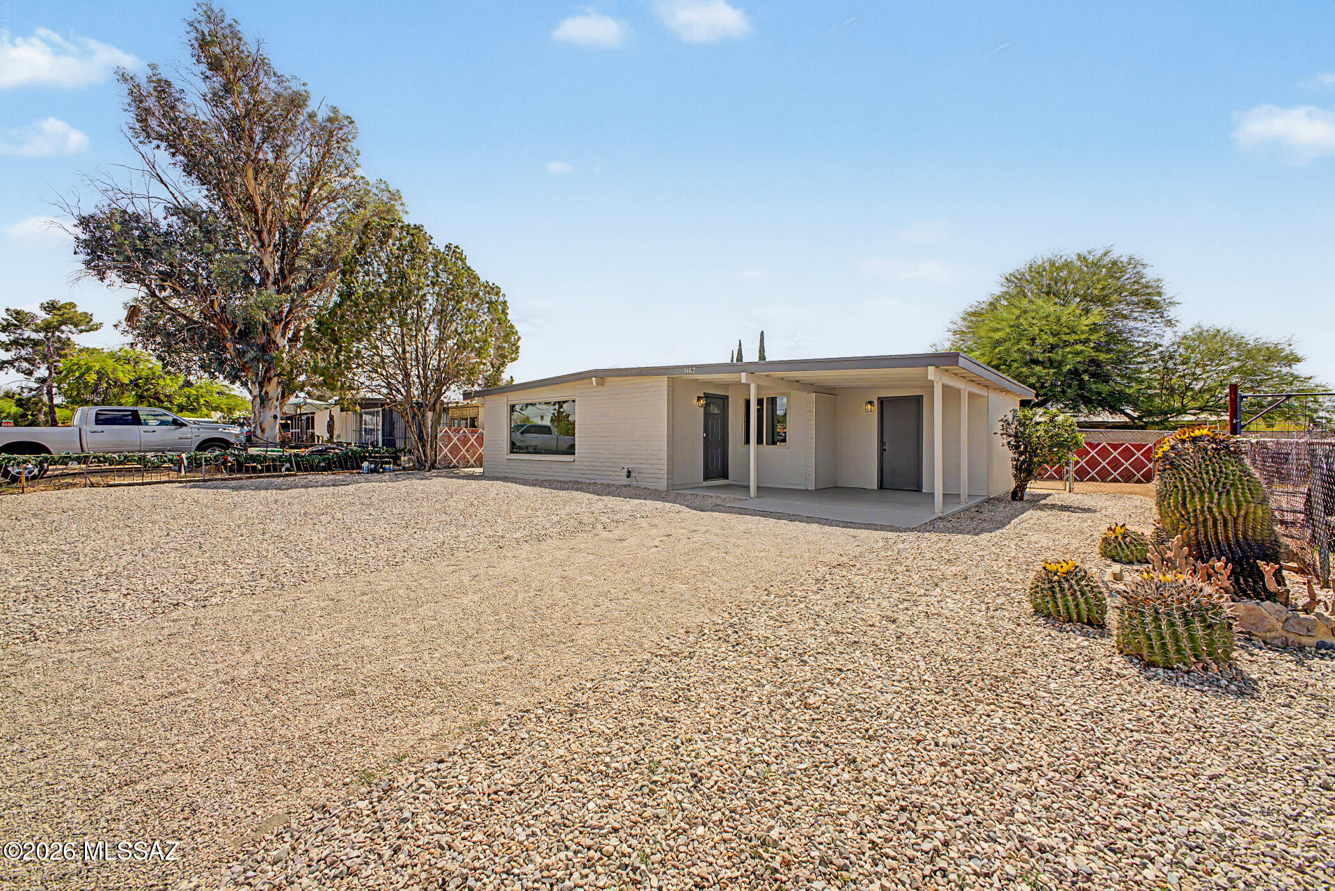 3402 South Kolb Road Tucson, AZ 85730 - Photo 32 of 32 a front view of a house with garden