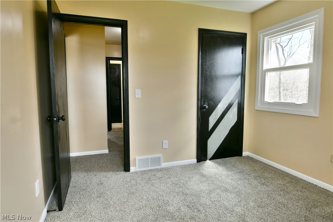 105 Fairview Avenue Cortland, OH 44410 - Photo 37 of 47 Unfurnished bedroom featuring light carpet and baseboards