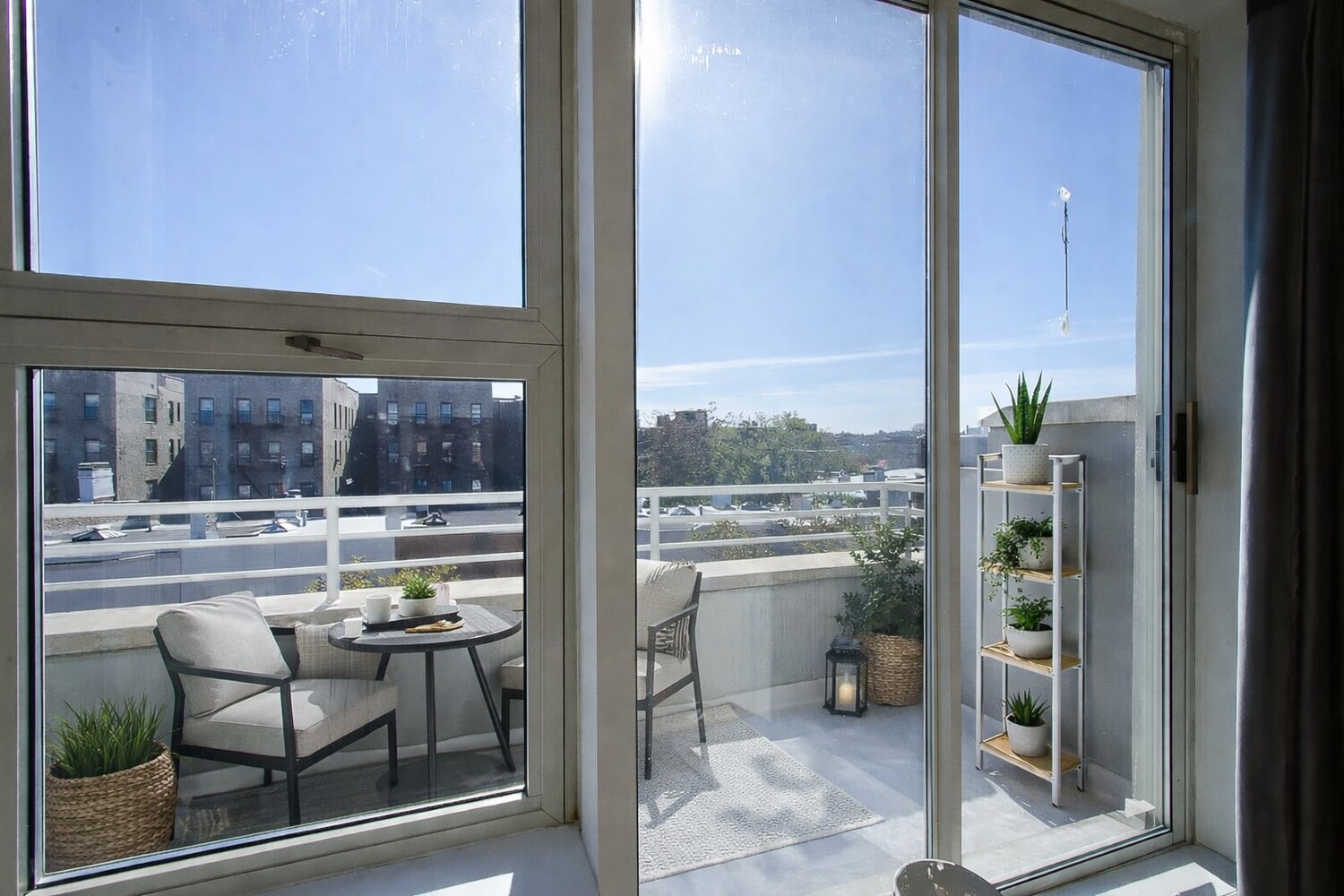 63 Conselyea Street, Unit A4 Brooklyn, NY 11211 - Photo 9 of 18 a room with furniture and a floor to ceiling window