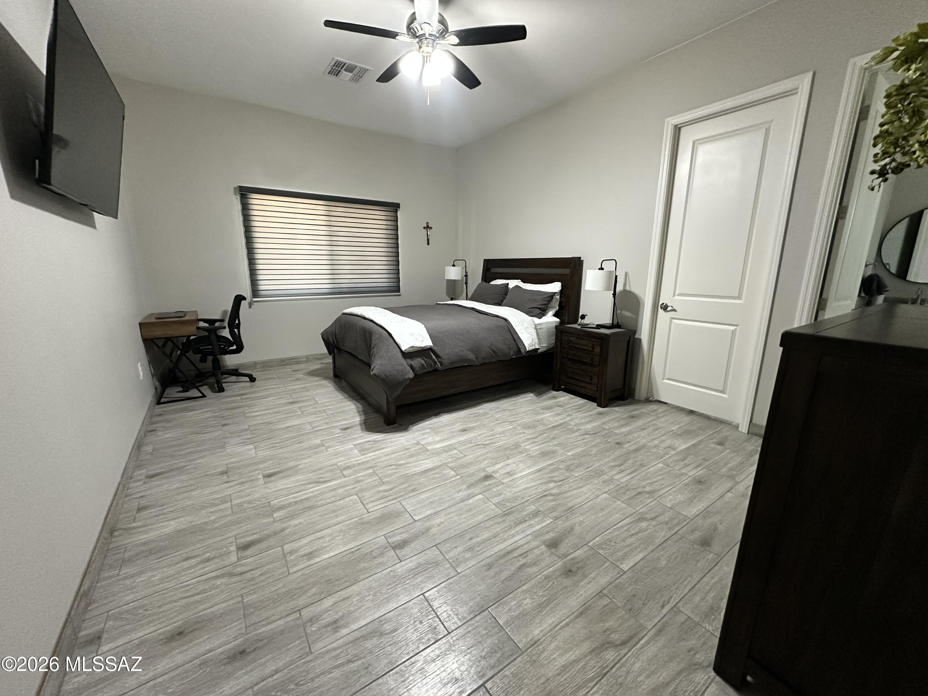 117 Ver Patria Rio Rico, AZ 85648 - Photo 16 of 28 a bedroom with a bed and a flat screen tv