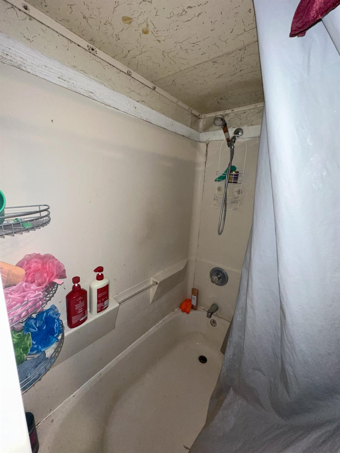 115 Yonkers Street Plainview, TX 79072 - Photo 18 of 20 a bathroom with a bathtub and a shower
