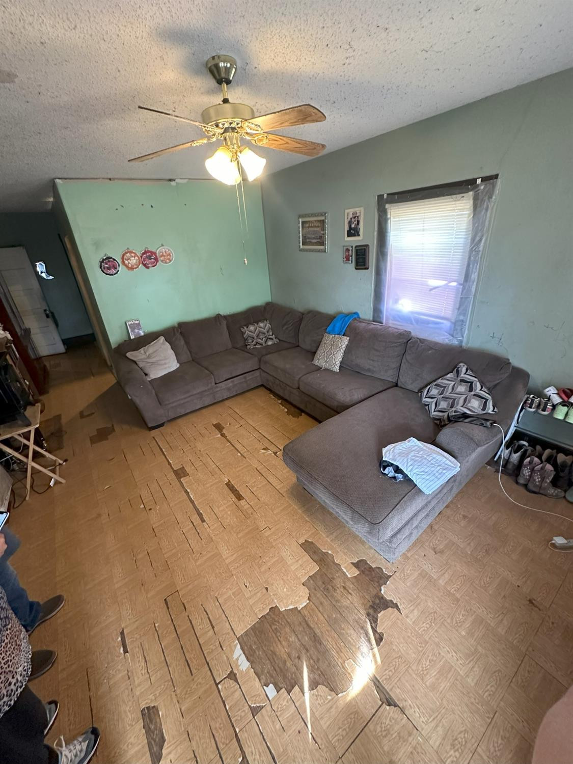 115 Yonkers Street Plainview, TX 79072 - Photo 9 of 20 a living room with furniture and a flat screen tv