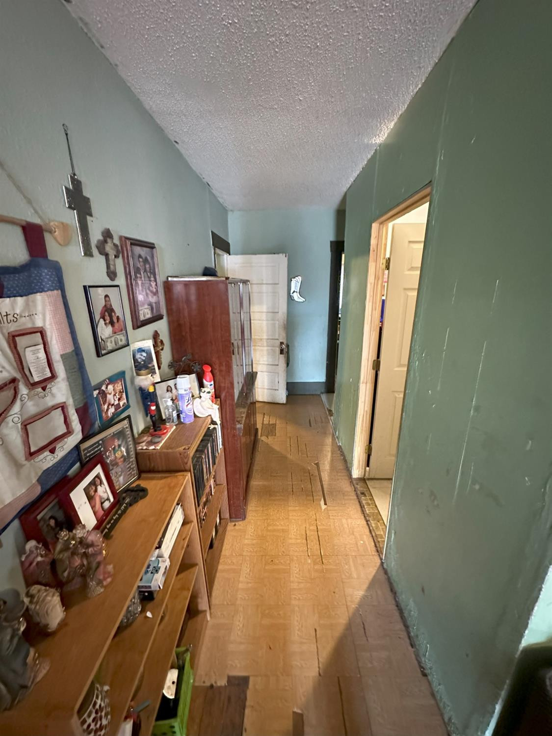 115 Yonkers Street Plainview, TX 79072 - Photo 10 of 20 a view of a bedroom with door and furniture